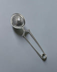 Zero Waste Outlet stainless steel ball tea strainer with a secure clasp handle for loose-leaf tea and spices.