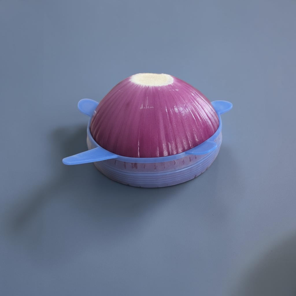 Zero Waste Outlet blue silicone stretchy lid covering a half-cut red onion to keep it fresh in the fridge.