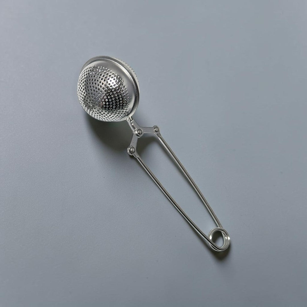 Zero Waste Outlet stainless steel ball tea strainer with a secure clasp handle for loose-leaf tea and spices.