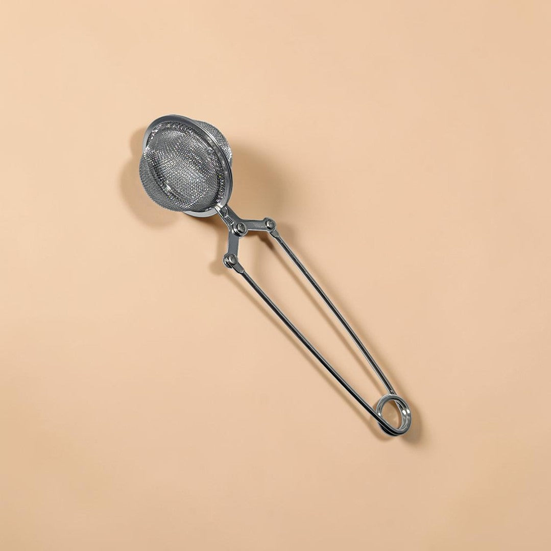 Zero Waste Outlet stainless steel mesh tea ball strainer with a long handle and secure clasp for loose-leaf tea.