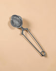 Zero Waste Outlet stainless steel mesh tea ball strainer with a long handle and secure clasp for loose-leaf tea.